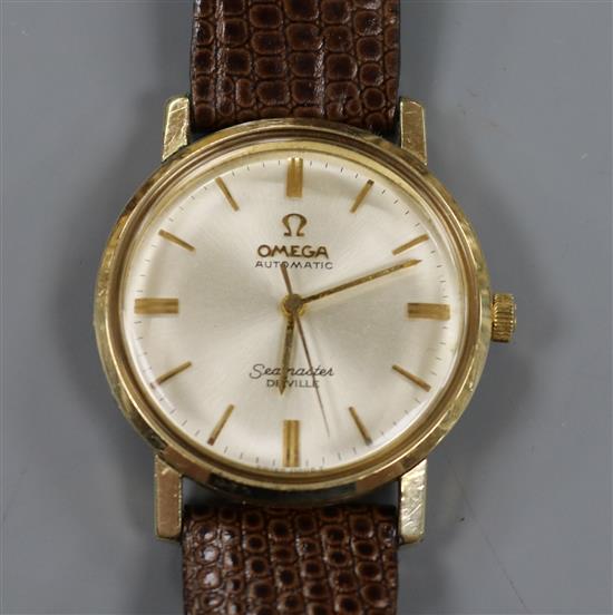 A gentlemans gold plated Omega Automatic Seamaster De Ville mid-size wrist watch, on associated bracelet.